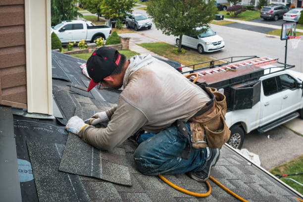 Professional Roofing technician working in Conrad, IA